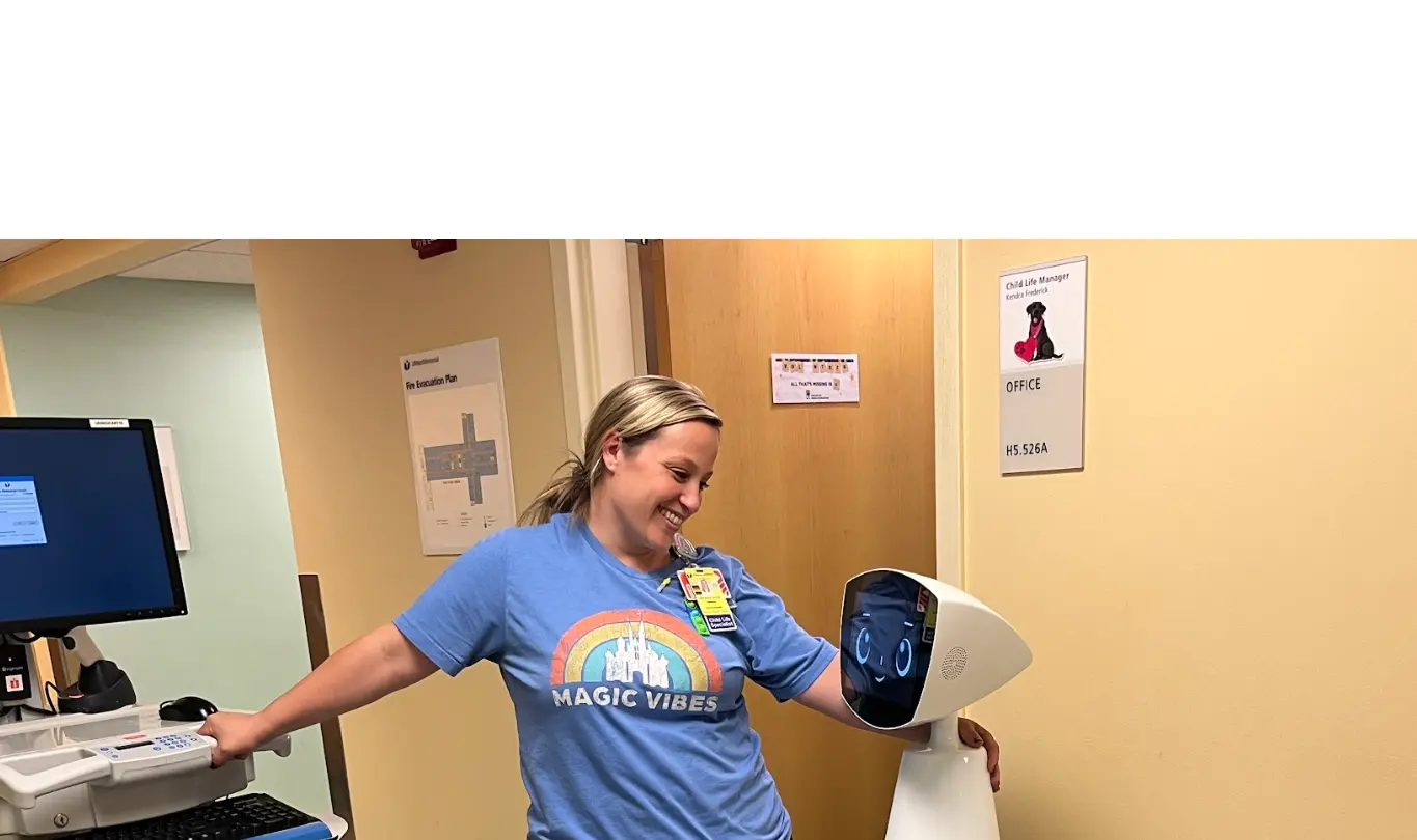 Robin with an elder at a facility